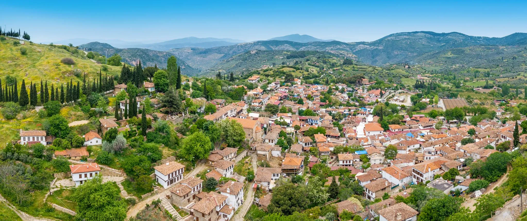 Şirince village and its red-tiled roofs among green hills and olive groves